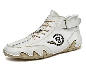Side detail of white mid-top handmade leather casual shoe with velcro strap and laces
