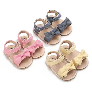 Adorable soft sole baby girl summer sandals featuring large bow designs in pastel colors