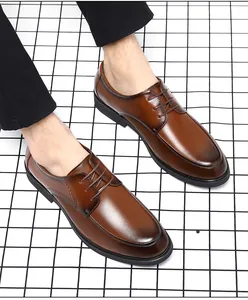 Classic brown leather Derby shoes for men featuring a business casual style on a grid floor