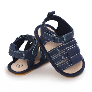 Dunkelblaue Babysandalen mit weicher Gummisohle und Klettverschluss für Kleinkinder.