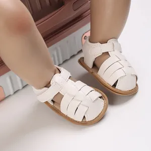 White soft-sole baby sandals for 0-1 year olds with breathable woven hollow design