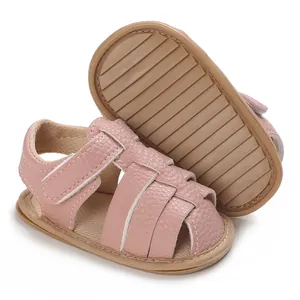 Detail of pink soft sole baby sandals featuring premium textured leather and velcro strap