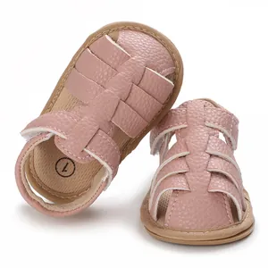Detail view of pink soft-soled baby sandals featuring woven texture and breathable design