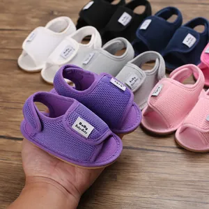 Close-up of breathable mesh baby sandals with soft rubber soles in various colors.