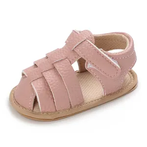 Pink soft-sole infant sandals featuring premium pebbled leather and velcro strap closure
