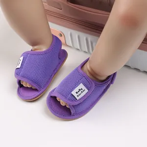 Detailed view of purple breathable mesh baby walking shoes with soft non-slip soles.