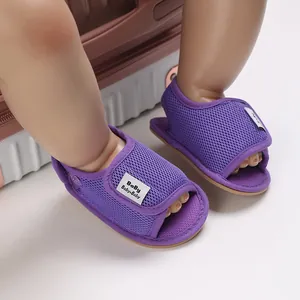 Detailed close-up of purple breathable mesh baby walking shoes with non-slip soft soles.