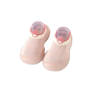 Pink knitted baby sock shoes with non-slip soft soles for toddlers and infants