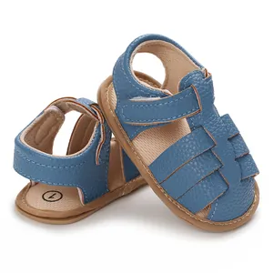 Detailed view of blue faux leather soft sole baby sandals with velcro strap detail
