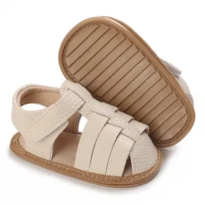 Close-up of soft-soled beige baby sandals with non-slip rubber outsoles