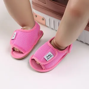 Close-up of breathable pink mesh baby walking shoes with soft non-slip soles and velcro