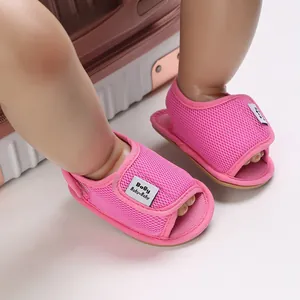 Detail of pink mesh baby walking shoes with velcro strap and soft rubber sole
