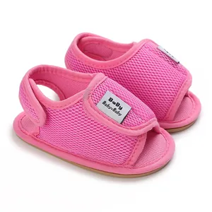 Close-up of pink breathable mesh baby sandals with soft rubber soles for toddlers