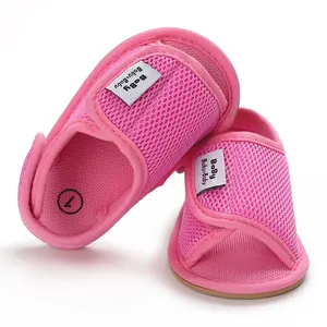 Close-up detail of pink breathable mesh baby walking shoes with soft non-slip rubber soles.