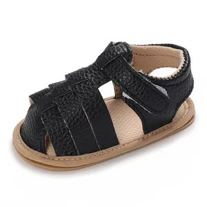 Classic black pebbled leather infant sandals with soft tan soles for summer comfort