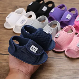 Close-up of colorful baby mesh walking sandals with soft soles and velcro straps