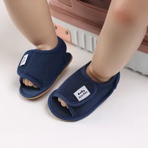 Close-up of breathable blue mesh baby sandals with soft rubber sole for infants