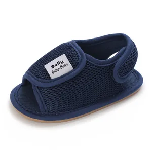Close-up of navy blue mesh baby sandals with soft rubber sole and Velcro strap