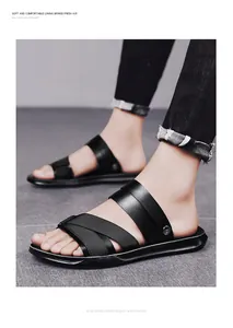 Close-up of men's black PU leather cross-strap sandals for beach and outdoor use.