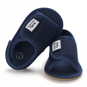 Close-up detail of dark blue breathable mesh baby walking shoes with soft sole
