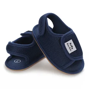 Detailed view of navy blue baby shoes with soft non-slip rubber soles for toddlers