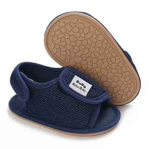Detail of navy blue baby walker shoes with breathable mesh and non-slip rubber sole