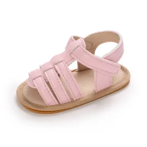 Detailed close-up of pink baby walking sandals with anti-slip rubber sole for summer