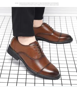 Close-up of brown perforated dress shoes showing breathable hole details