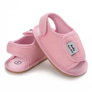 Macro view of pink breathable mesh baby sandals with Velcro strap and soft sole