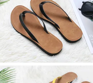 Close-up of comfortable women's flat flip-flops with brown soles and black straps