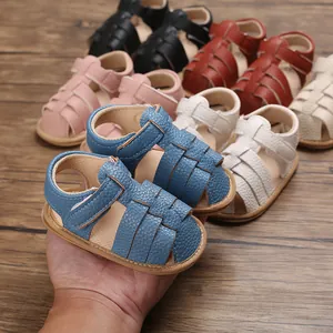 Close-up of soft-soled baby summer sandals in multiple colors with velcro straps