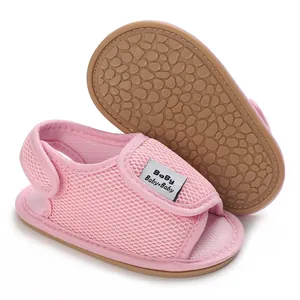 Close-up detail of pink mesh baby sandals featuring a non-slip soft rubber sole texture