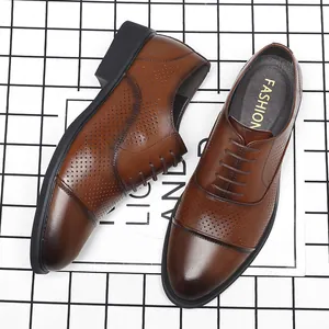 Classic brown perforated leather dress shoes for men with breathable cap-toe design