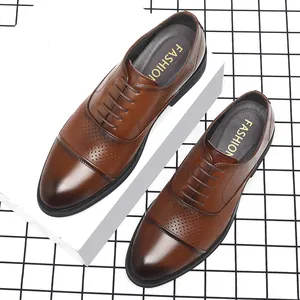 Classic brown leather men's cap toe dress shoes with breathable perforated hole details