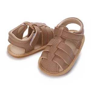 Detailed view of brown faux leather baby summer sandals featuring non-slip soft soles