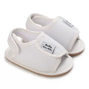 Detailed view of white breathable mesh baby sandals with soft non-slip rubber soles.