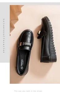 Overhead view of black women's flat work shoes with soft non-slip soles and gold detail