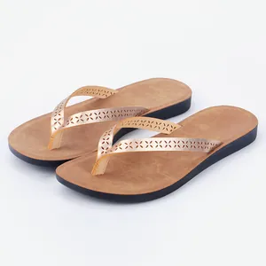Stylish women's PU leather flip-flops with decorative hollow-out patterns for beach