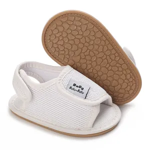 Detail view of white breathable mesh baby shoes with soft non-slip rubber soles