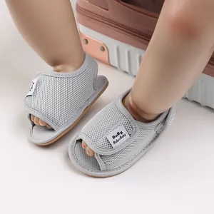 Macro detail of breathable grey mesh baby walking shoes with adjustable Velcro strap