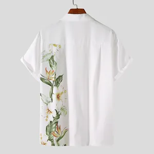 Back view of white men's short sleeve shirt with vibrant tropical floral pattern.