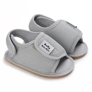 Detail of breathable grey mesh baby walking shoes with soft non-slip rubber soles