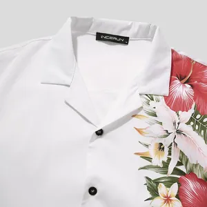 Detailed view of white men's Hawaiian shirt featuring vibrant tropical floral print