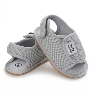 Close-up detail of gray breathable mesh baby walking sandals with soft rubber soles