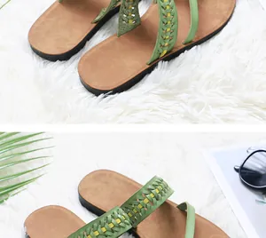 Close-up showing the green woven hollow-out straps on these stylish flat beach flip-flops