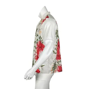 Side view detail of a white short-sleeved men's Hawaiian shirt with red hibiscus print.