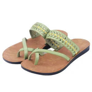 Stylish women's light green flat sandals featuring hollow woven straps and comfortable toe loop