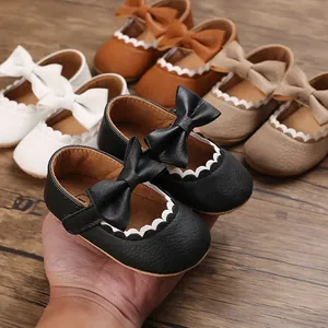 Detailed close-up of soft-soled baby princess shoes with bow detail in multiple colors