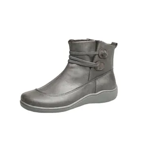 Grey faux leather ankle boots for women with elastic side decorative straps and flat sole