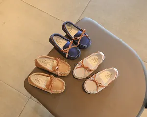 Children's British style loafers with bow ties shown in three different colors